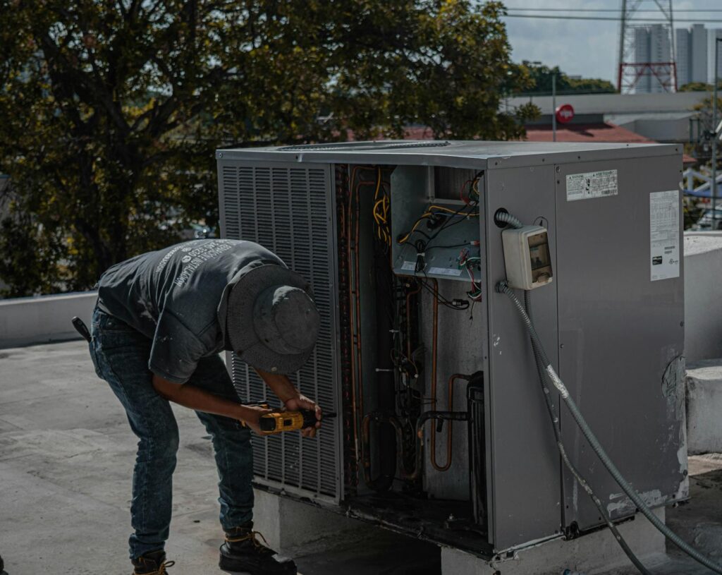HVAC technician fixing air conditioner
