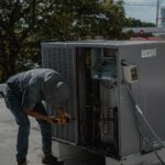 HVAC technician fixing air conditioner