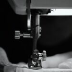 sewing machine stitches fabric